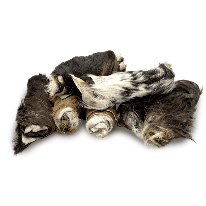 Pile of t forrest goat skin rolls with fur dog treats